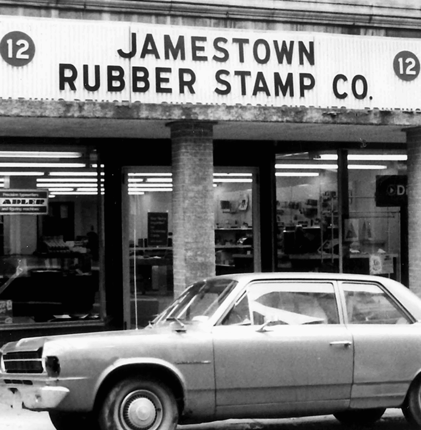 Historic black-and-white Jamestown Rubber Stamp Company storefront
