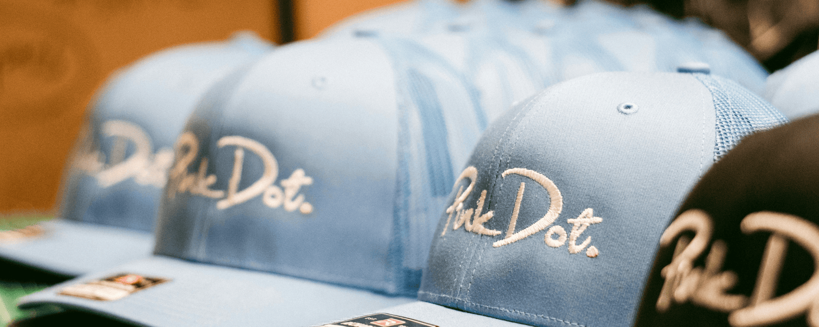 Team members wearing matching branded shirts and hats